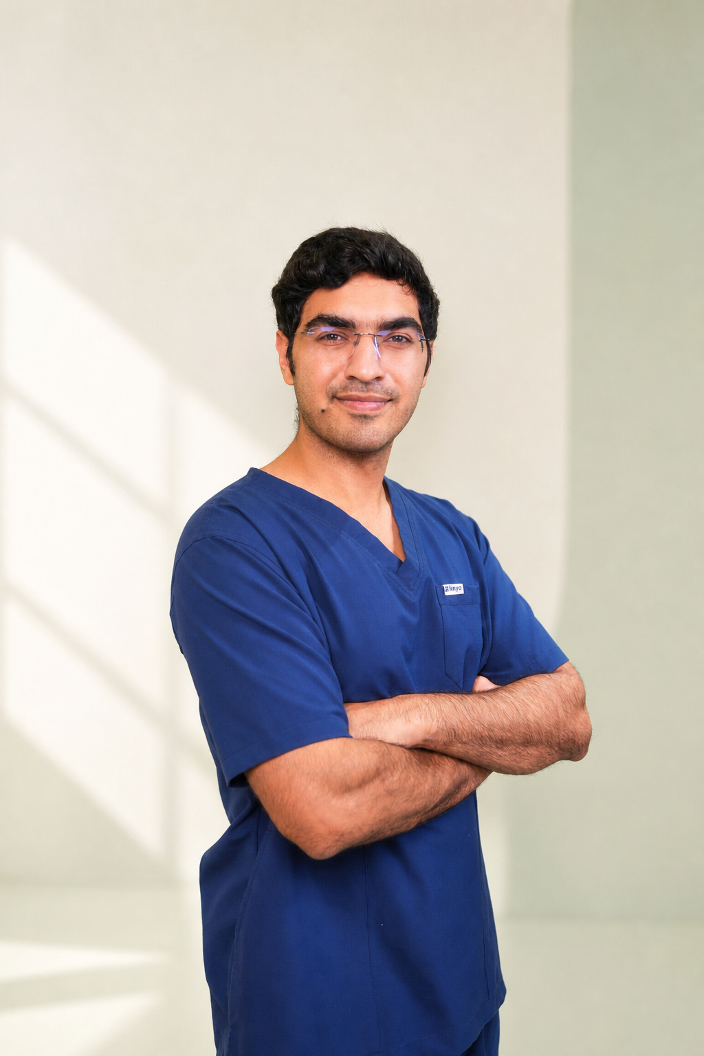 Dr. Pai in surgical scrubs